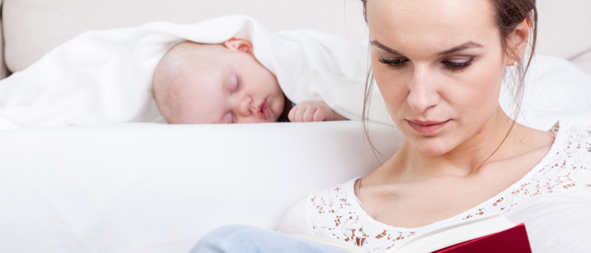 Charming mother showing images in a book to her cute little son at home; Shutterstock ID 62506669; Name: Matthew Beaman (Forward); Cost Centre: 71203; User ID: NF84